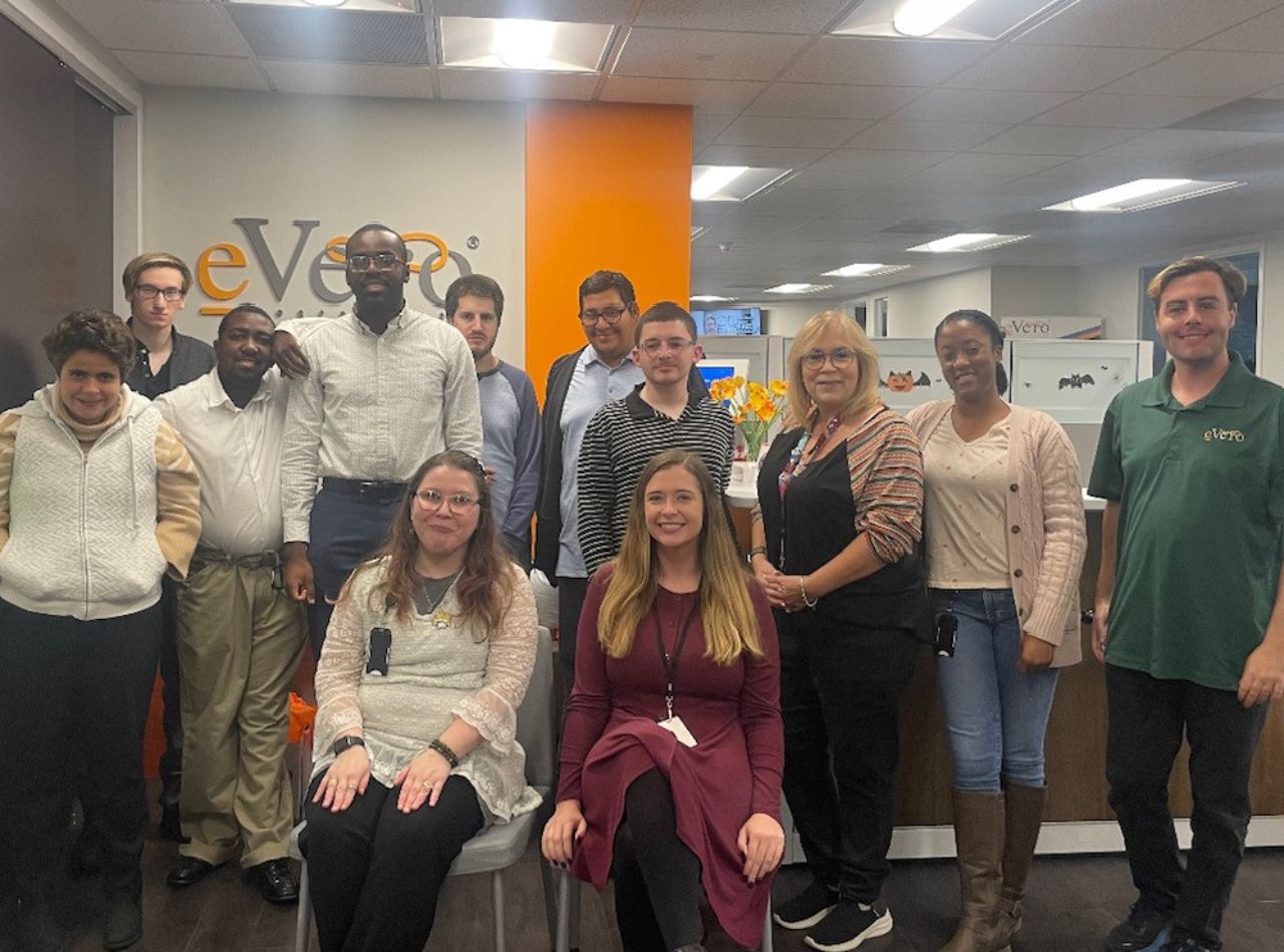People from YAI's Westbury Supported Employment program and eVero staff at eVero's headquarters.