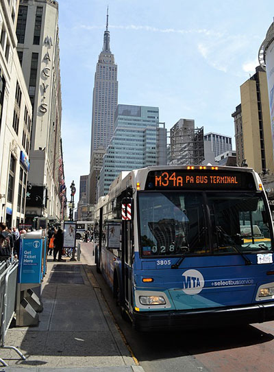 NY MTA Metro Area Bus with Empire State Building in background