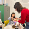MSA student touching a tortoise that a staff person is holding for them