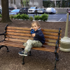 MSA student sits on a park bench