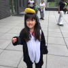 MSA student wearing a penguin onsie stands outside and smiles for photo