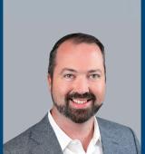 Headshot of Kevin Carey, CEO of YAI