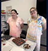 Ashley and her sister at a Baking Coach class for rainbow cookie cupcakes.