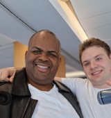 Kenneth (left) and friend (right) stand side by side at the Grease-themed party
