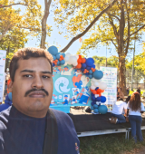 Orlando poses in Sunset Park at the Health Empowerment Fair