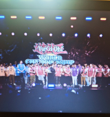 screenshot of a lot of people on stage for yu-gi-oh championship