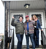 Nate, Ira, and Wende stand outside YAI's newly named "Goodman Residence" in Bayside