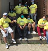 Group shot of people from YAI's East Tremont location, all wearing yellow Central Park Challenge Shirts