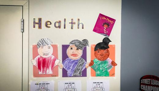 Hand made poster with the word "health" portrays 3 people