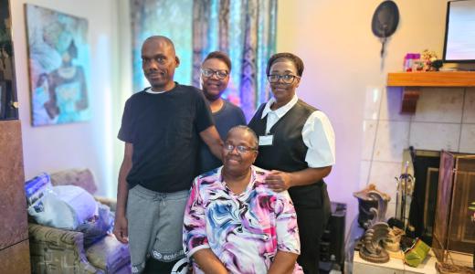 James Keys poses with his mother and sisters at his mother's home