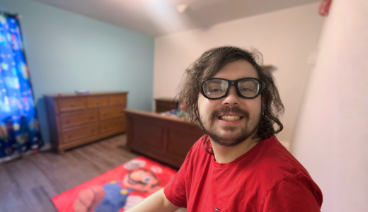 Tyler smiles for the photo, you can see his new bedroom behind him.