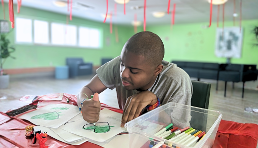 Justin at the respite center in Kingston, he's focused on coloring in. 