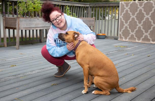 Lady Godiva resident with adopted dog