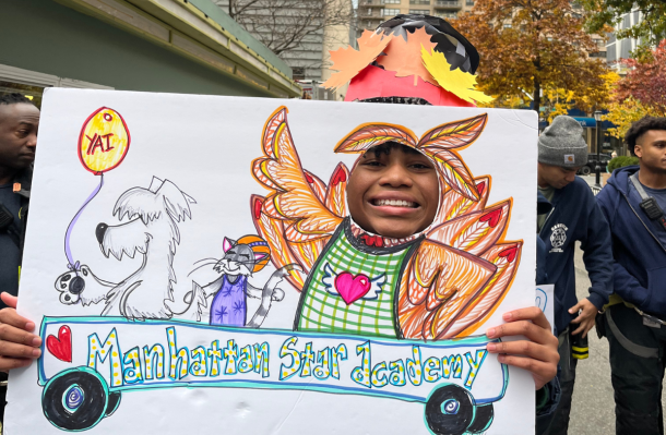 MSA student holds up a sign for the turkey fest