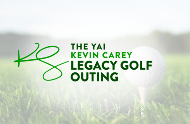 golf ball on a tee in the grass with a white overlay and logo for the "The YAI Kevin Carey Legacy Golf Outing"