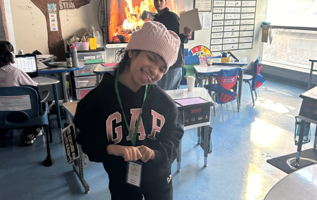 MSA student poses for photo in classroom