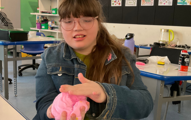 MSA student holds out what looks like pink slime