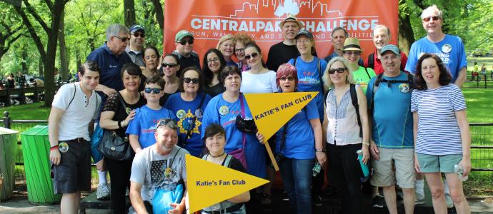 A big group of people (families, people YAI supports, and friends) who support YAI in Central Park at the Central Park Challenge. 