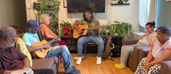 DSP Reginald Williams jams out with Ocean Parkway IRA residents