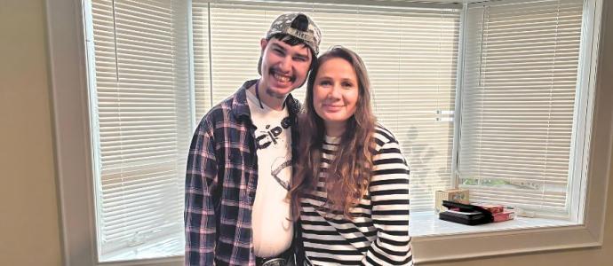Eddy and Mariia pose for photo at the group home