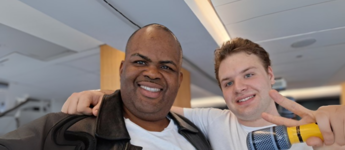 Kenneth (left) and friend (right) stand side by side at the Grease-themed party