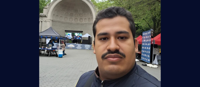 Orlando stands in front of the Bandshell in Central Park