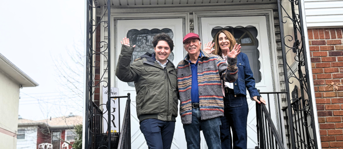 Nate, Ira, and Wende stand outside YAI's newly named "Goodman Residence" in Bayside