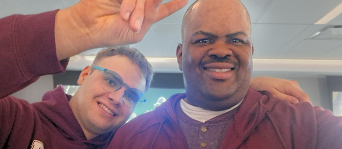 kenneth and a friend stand together for a selfie