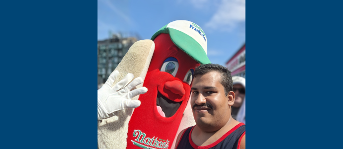 Orlando (right) poses with someone in a nathan's hotdog costume