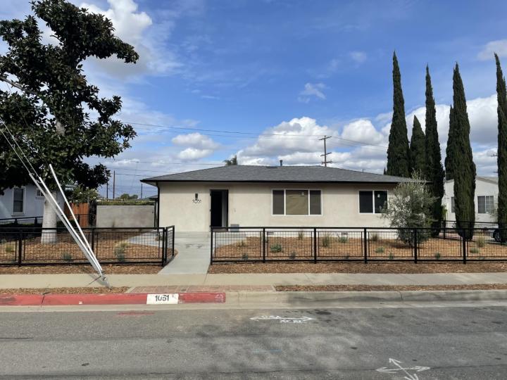 house with trees on either side and blue sky. how is located in California