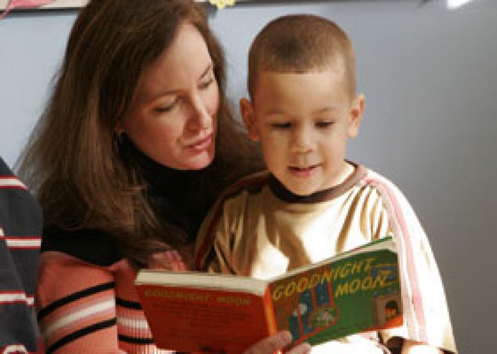 Woman reading to child