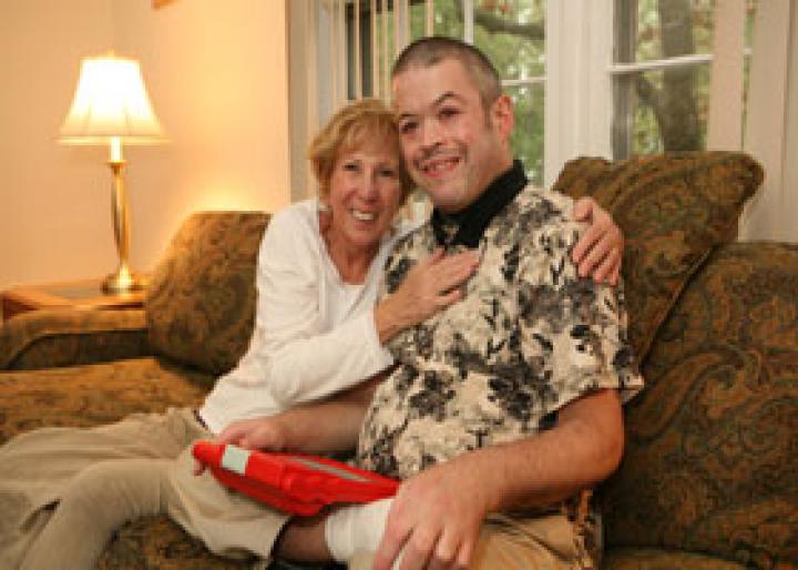 Family hugging on couch