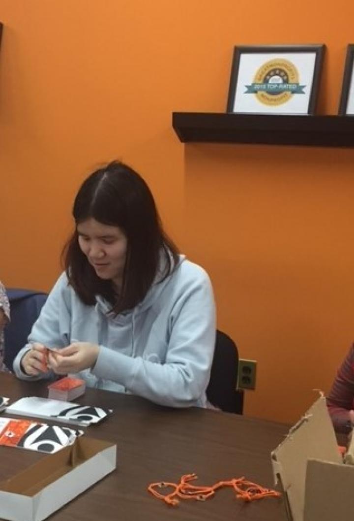 Angela making a bracelet