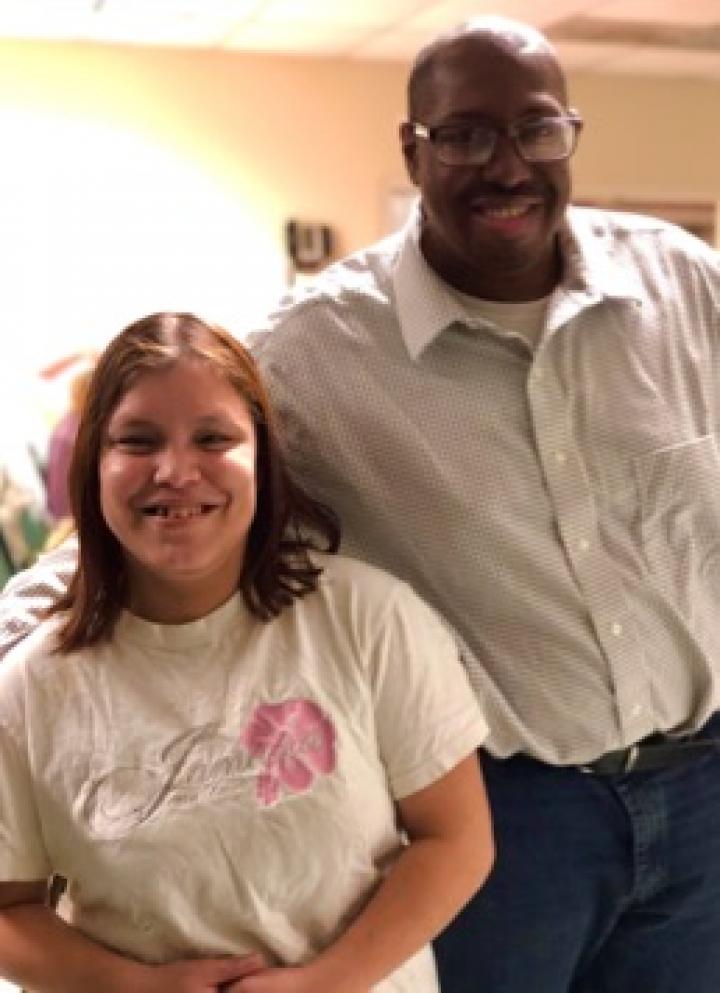 Nadia Menoscal and Leon Owens stand together for a photograph