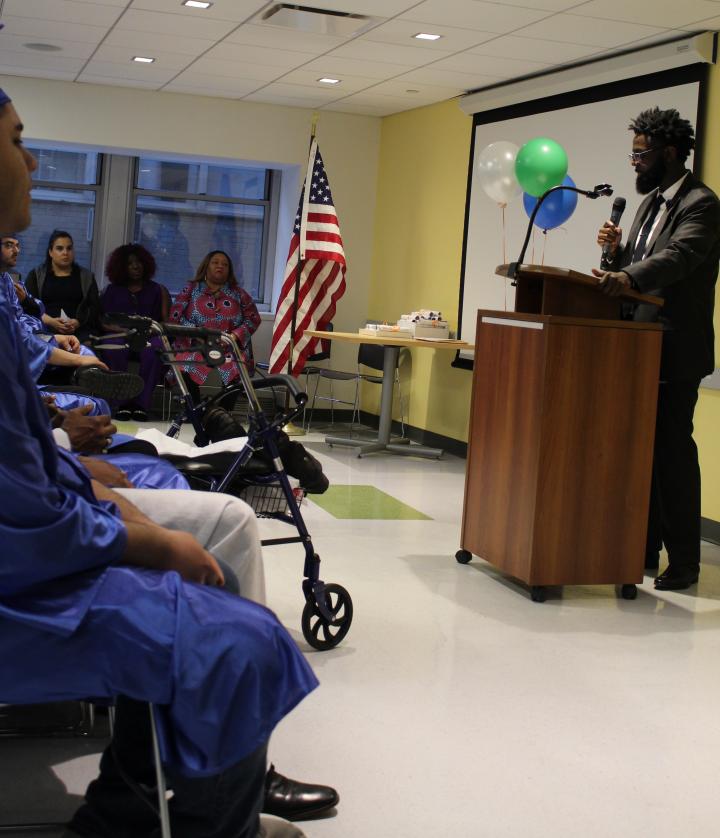 Ja-mel standing at a podium accepting an award from ICD