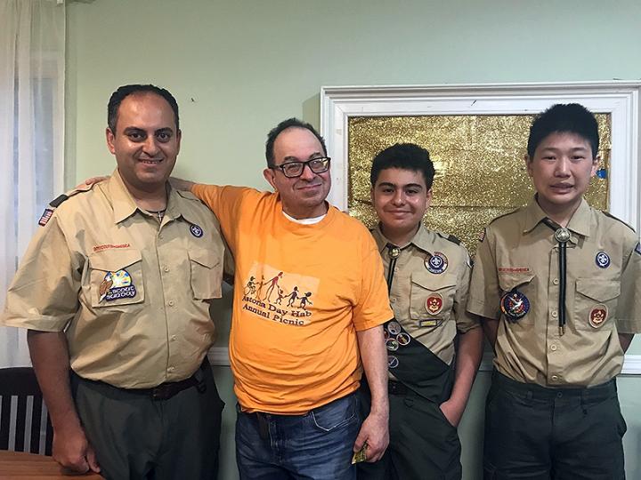 Resident introduces the Boy Scouts to his housemates at YAI’s Alan Butger residence.