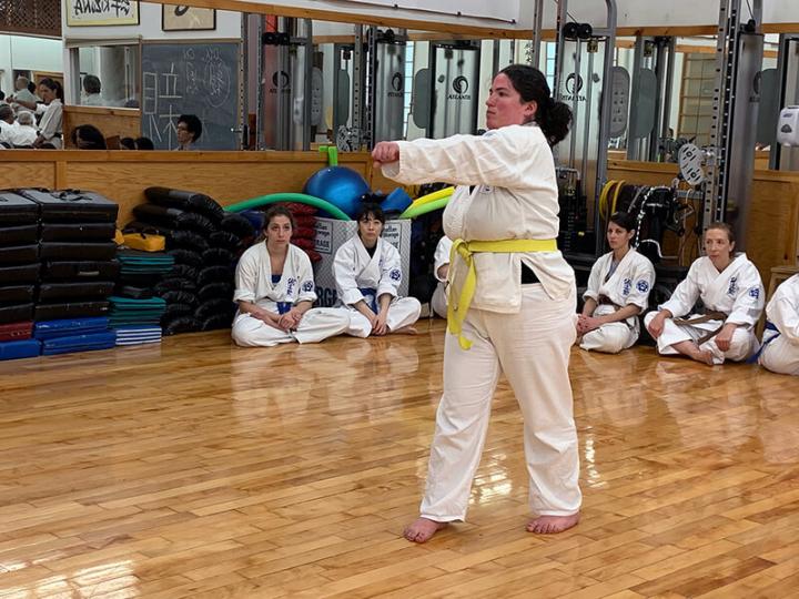 photo: Advanced yellow belt, Jennifer Naftelowitz, practicing her karate moves