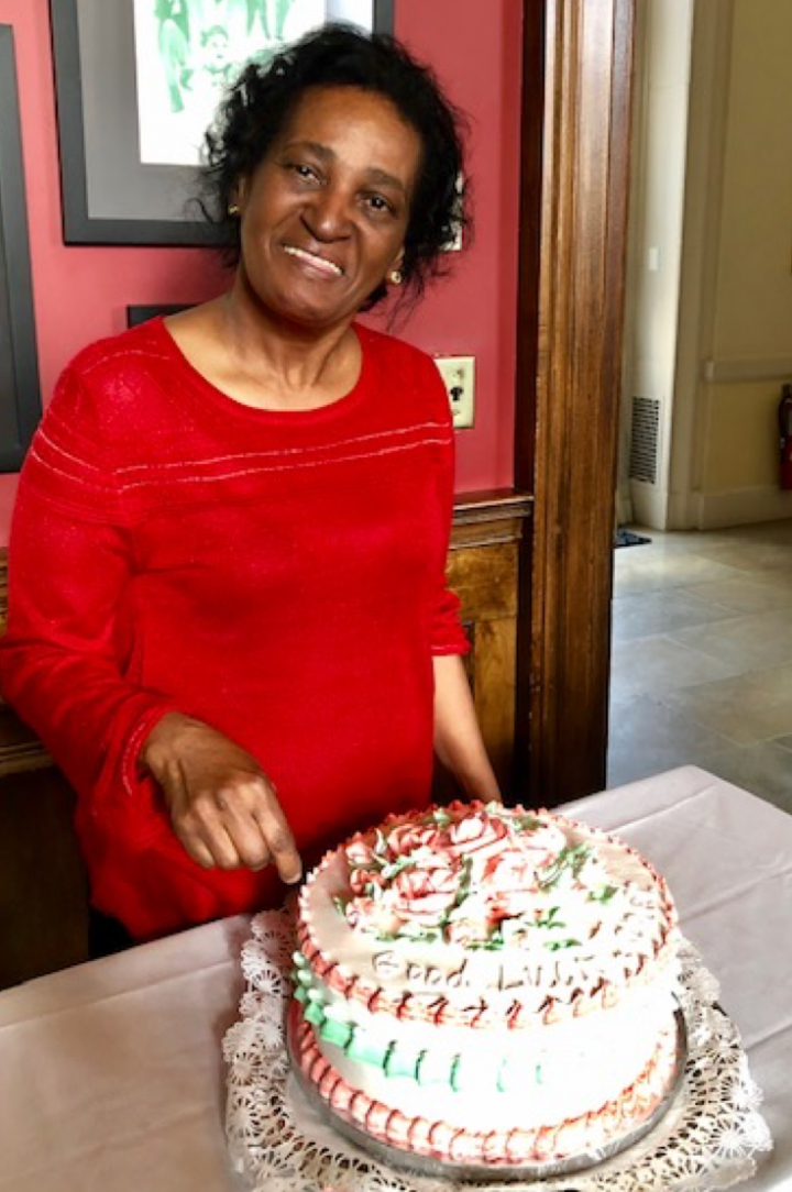 Janet Channer cutting her retirement cake