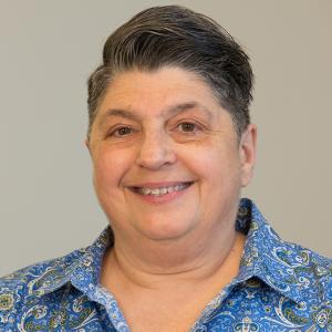 Marie Cavallo - Chief Quality, Compliance, & Ethics Officer Marie Cavallo - wearing a blue and green paisley shirt