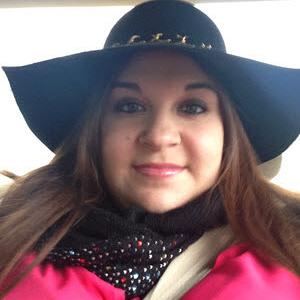 Nicole Riccio Photograph of Nicole Riccio wearing a black broad rimmed hat