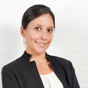 Tiffany Pendola, Principal of iHOPE Professional headshot of Tiffany Pendola wearing a white collarless top and black jacket