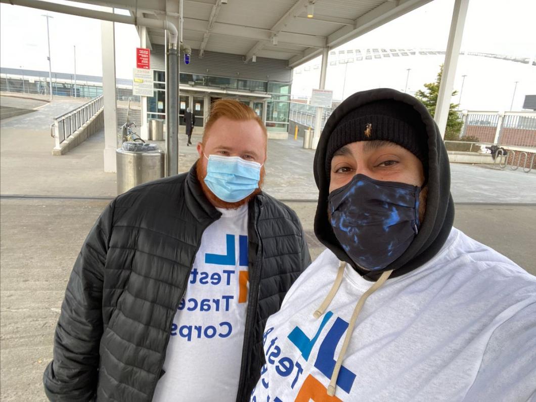 Tyler Larsen and Chris Valladares ready to distribute materials at the ferry terminal.