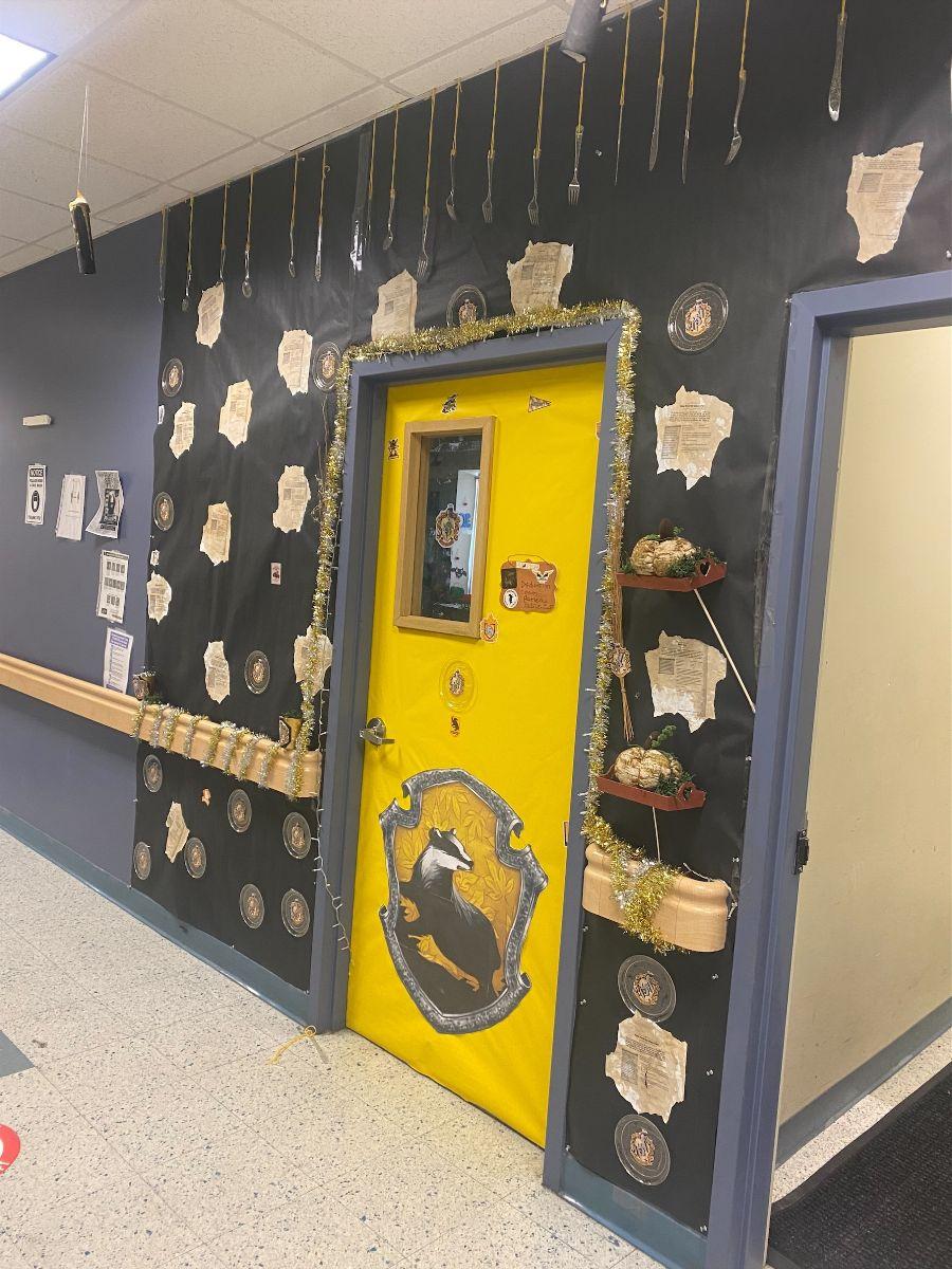 Door in a hallway decorated in Yellow and Badgers for Hufflepuff