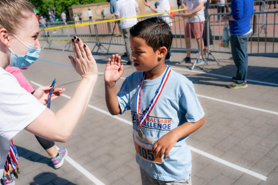 Grayson at last years CPC, wearing a medal and high-fiving someone.