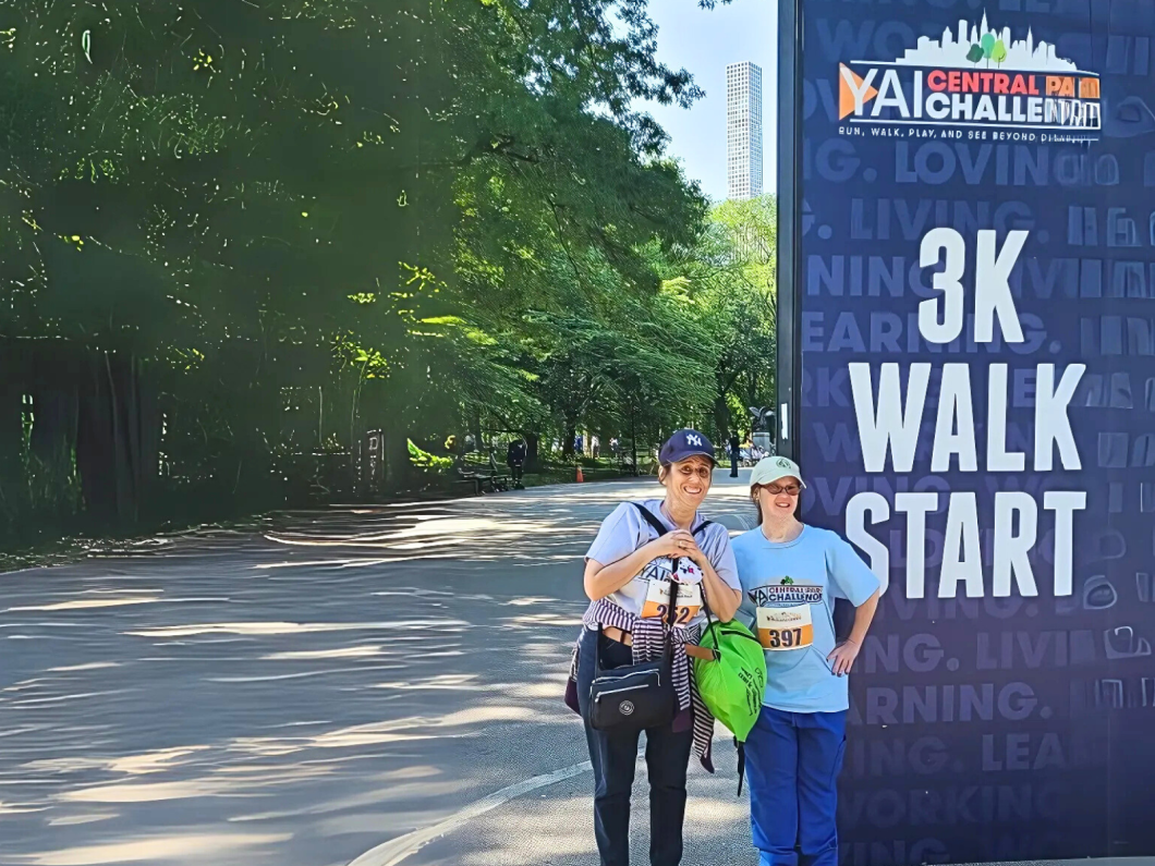 Janice and her sister stand next to the start line for the 3k walk at central park challenge