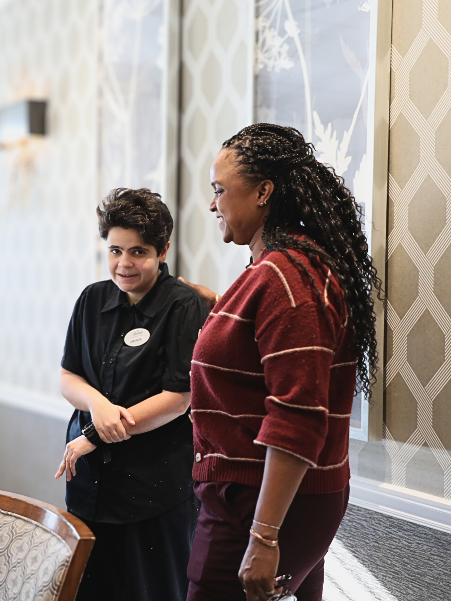 Amanda and Caputo stand together in the dining room at The Bristal
