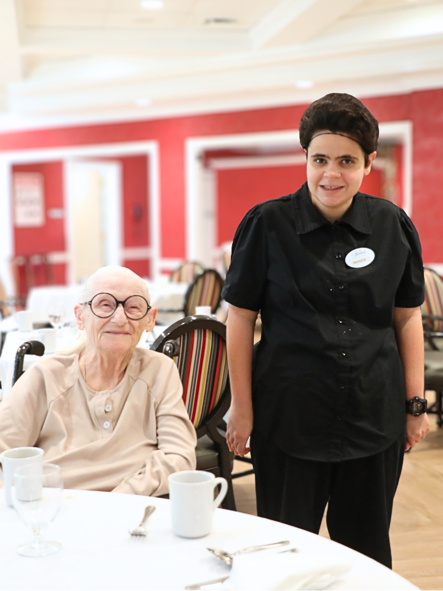 Amanda and and Carolyn pose together in the dining room at The Bristal
