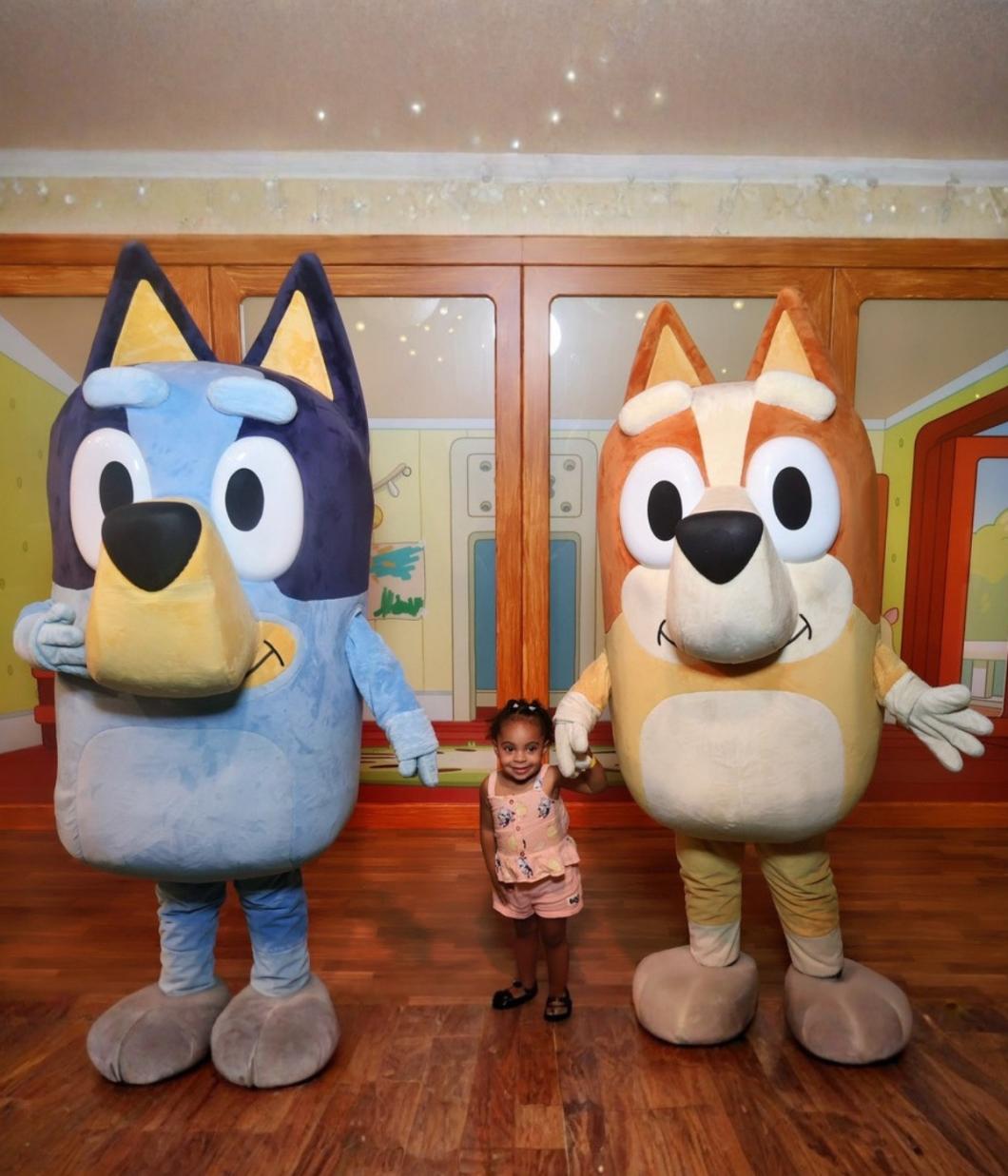 Princess stands with Bluey and Bringo