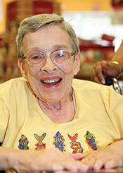 Media Name: woman-smiling-in-yellow-shirt.jpg